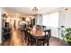 Dining room with wooden table, hardwood floors, and ample natural light next to an open kitchen at 2745 33Rd Ne Ave, Hickory, NC 28601