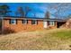 A well-maintained, single-story brick home featuring classic shutters and a cozy covered carport at 2745 33Rd Ne Ave, Hickory, NC 28601