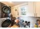 Laundry room with white-painted brick walls and modern washer and dryer at 2745 33Rd Ne Ave, Hickory, NC 28601