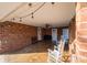 Covered patio with white rocking chairs, ceiling fan, and string lights at 2745 33Rd Ne Ave, Hickory, NC 28601