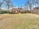 Brick house with a well-maintained lawn and landscaping at 3013 Tiffany Dr, Monroe, NC 28110