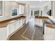 Kitchen with granite countertops, white cabinets, and tile flooring at 3013 Tiffany Dr, Monroe, NC 28110