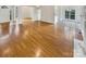 Open floor plan with hardwood floors and views into other rooms at 3013 Tiffany Dr, Monroe, NC 28110