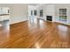 Hardwood floors throughout the living room, with a view into the kitchen at 3013 Tiffany Dr, Monroe, NC 28110