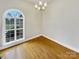 Bright office space with hardwood floors and an arched window at 3013 Tiffany Dr, Monroe, NC 28110