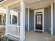 Front porch with white columns and gray railings at 3089 Virginia Trail Ct, Fort Mill, SC 29715