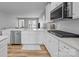 Modern kitchen with white cabinets and stainless steel appliances at 3089 Virginia Trail Ct, Fort Mill, SC 29715