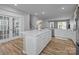 Open concept kitchen with white cabinets and an island at 3089 Virginia Trail Ct, Fort Mill, SC 29715