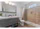 Beautiful bathroom featuring double sinks, tile shower with seat and niche, plus modern fixtures at 309 Lloyd St, Salisbury, NC 28144