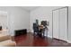 Bedroom featuring hardwood floors, a closet, a desk and chair with a large screen monitor for gaming or office use at 309 Lloyd St, Salisbury, NC 28144