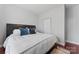 Bright bedroom featuring a comfortable bed, rich wood floors and closet in a neutral paint scheme at 309 Lloyd St, Salisbury, NC 28144