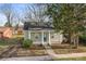 Charming single story home with a welcoming covered porch, light green siding and a tidy front lawn at 309 Lloyd St, Salisbury, NC 28144