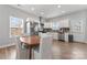 Bright kitchen featuring stainless steel appliances, white cabinets and an adjacent dining area with seating for four at 309 Lloyd St, Salisbury, NC 28144