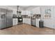 Bright kitchen featuring stainless steel appliances, white cabinets, granite countertops and a view of the backyard at 309 Lloyd St, Salisbury, NC 28144