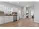 Kitchen featuring stainless steel appliances, white cabinets, granite countertops and access to adjacent rooms at 309 Lloyd St, Salisbury, NC 28144