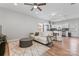 Bright living space with hardwood floors, ceiling fan, and an open layout to the kitchen at 309 Lloyd St, Salisbury, NC 28144