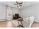 Bright living space with hardwood floors and ceiling fan at 309 Lloyd St, Salisbury, NC 28144