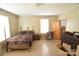 Well-lit bedroom with hardwood floors and large windows at 315 S Hill St, Gastonia, NC 28052