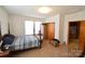 Bright bedroom with hardwood floors and ample closet space at 315 S Hill St, Gastonia, NC 28052