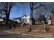 Gray house with red brick steps and a tree-lined street at 315 S Hill St, Gastonia, NC 28052