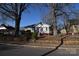 Gray house with red brick steps, tree-lined street view at 315 S Hill St, Gastonia, NC 28052