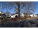 Row of houses, gray house with red brick, tree-lined street at 315 S Hill St, Gastonia, NC 28052