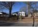 Gray house with red brick steps, situated on a tree-lined street at 315 S Hill St, Gastonia, NC 28052