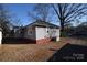 Ranch home with grey siding and a red brick foundation at 315 S Hill St, Gastonia, NC 28052