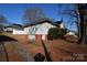 Side view of house showcasing landscaping and driveway at 315 S Hill St, Gastonia, NC 28052