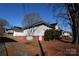 Side view of house showcasing landscaping and driveway at 315 S Hill St, Gastonia, NC 28052