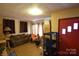 Living room with brown couch, exercise bike, and packed boxes at 315 S Hill St, Gastonia, NC 28052