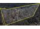 Expansive aerial view of heavily wooded property surrounded by yellow boundary lines at 3609 Shillinglaw Rd, Sharon, SC 29742