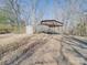 Carport and storage shed on a large lot with a dirt driveway at 3609 Shillinglaw Rd, Sharon, SC 29742