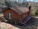 Aerial view of the cabin showing the outdoor deck and wooded surroundings at 3609 Shillinglaw Rd, Sharon, SC 29742