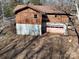 Rear view of the cabin, highlighting its two-story design and wooded surroundings at 3609 Shillinglaw Rd, Sharon, SC 29742