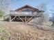 Exterior view of the cabin's raised deck supported by beams and wooden posts at 3609 Shillinglaw Rd, Sharon, SC 29742