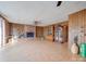 Spacious living room with wood floors, a fireplace with built-in bookcases, and wood paneling at 3609 Shillinglaw Rd, Sharon, SC 29742