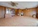 Large living room featuring wood floors, ceiling fans, and a built-in china cabinet at 3609 Shillinglaw Rd, Sharon, SC 29742