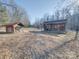 Rustic outbuildings on the property, surrounded by a sparse, winter landscape at 3609 Shillinglaw Rd, Sharon, SC 29742