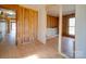 Image of a room under construction with exposed framing, a doorway, hardwood floors, and wood paneling at 3609 Shillinglaw Rd, Sharon, SC 29742