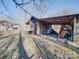 View of a weathered shed with open storage areas, surrounded by a yard with sparse foliage at 3609 Shillinglaw Rd, Sharon, SC 29742