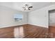 Bright bedroom featuring hardwood floors and a ceiling fan at 3915 Allenby Pl, Monroe, NC 28110