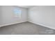 Simple bedroom with carpeted floor and window at 3915 Allenby Pl, Monroe, NC 28110