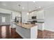 Modern kitchen with white cabinets, granite countertops, and stainless steel appliances at 3915 Allenby Pl, Monroe, NC 28110