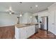 Modern kitchen with white cabinets, granite countertops, and stainless steel appliances at 3915 Allenby Pl, Monroe, NC 28110