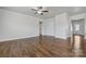 Spacious living room featuring hardwood floors and a ceiling fan at 3915 Allenby Pl, Monroe, NC 28110