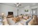 Living room with hardwood floors, a TV, and comfy seating at 3915 Allenby Pl, Monroe, NC 28110