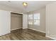 Bedroom with hardwood floors and a double-door closet at 3948 Shasta Cir, Clover, SC 29710