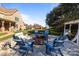 Backyard with seating area featuring a fire pit, chairs, and well-manicured lawn at 4008 Quintessa Dr, Matthews, NC 28104