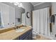 Bathroom featuring a granite countertop, a framed mirror, a toilet, and tiled shower with a shower curtain at 4008 Quintessa Dr, Matthews, NC 28104